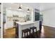 Bright kitchen with a central island, bar seating, and modern appliances at 382 Lofton Nw Rd, Atlanta, GA 30309