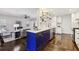 Open concept kitchen with a large island, modern cabinetry, and stainless steel appliances overlooking living area at 382 Lofton Nw Rd, Atlanta, GA 30309