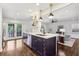 Stylish kitchen with a blue island, stainless steel appliances, and an open layout at 382 Lofton Nw Rd, Atlanta, GA 30309