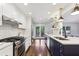 Beautiful updated kitchen featuring stainless steel appliances, white cabinets, and modern finishes at 382 Lofton Nw Rd, Atlanta, GA 30309