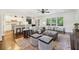 Open-concept living room connected to the kitchen with hardwood floors and neutral decor at 382 Lofton Nw Rd, Atlanta, GA 30309