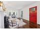 Inviting living room with a red front door, fireplace, and hardwood floors at 382 Lofton Nw Rd, Atlanta, GA 30309