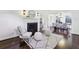 Bright living room with hardwood floors, a fireplace, and an open dining area at 382 Lofton Nw Rd, Atlanta, GA 30309