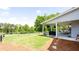 Spacious backyard with a covered patio, grill, and wooden fence, perfect for outdoor entertaining at 6505 Hampton Creek Dr, Cumming, GA 30041