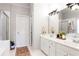 Bright bathroom featuring double sinks, white cabinets, and a glass-enclosed shower at 6505 Hampton Creek Dr, Cumming, GA 30041