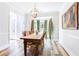 Elegant dining room features hardwood floors, bay windows with decorative curtains, and a chandelier at 6505 Hampton Creek Dr, Cumming, GA 30041