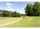 Scenic golf course view, with lush greenery and mature trees lining the fairway at 6505 Hampton Creek Dr, Cumming, GA 30041