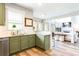 Bright kitchen with stainless steel appliances, modern fixtures, and an open view to the living room at 6505 Hampton Creek Dr, Cumming, GA 30041