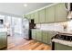 Modern kitchen features updated stainless steel appliances, custom cabinets and marbled countertops at 6505 Hampton Creek Dr, Cumming, GA 30041
