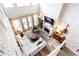 Bright living room boasting soaring ceilings, a stone fireplace, and a cozy sectional sofa at 6505 Hampton Creek Dr, Cumming, GA 30041