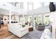 Bright living room with soaring ceilings, large windows, hardwood floors and stylish furnishings at 6505 Hampton Creek Dr, Cumming, GA 30041