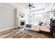 Spacious main bedroom with a fireplace, tray ceiling, and large windows at 6505 Hampton Creek Dr, Cumming, GA 30041