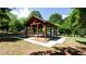 Outdoor pavilion in a grassy area surrounded by lush trees at 6505 Hampton Creek Dr, Cumming, GA 30041