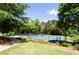 Scenic pickleball courts nestled among trees with landscaped surroundings at 6505 Hampton Creek Dr, Cumming, GA 30041