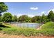 Outdoor tennis courts surrounded by greenery in a gated community at 6505 Hampton Creek Dr, Cumming, GA 30041