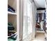 Well-organized walk-in closet with built-in shelves and ample storage space at 6505 Hampton Creek Dr, Cumming, GA 30041