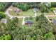 Aerial view of house showing surrounding trees and other houses nearby at 117 Constance Dr, Locust Grove, GA 30248