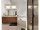 Bright bathroom with granite countertops, garden tub, glass enclosed shower, and warm tile flooring at 117 Constance Dr, Locust Grove, GA 30248