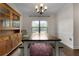 This dining room features a window, chandelier, wooden table, and a wooden hutch at 117 Constance Dr, Locust Grove, GA 30248