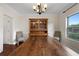 This dining room features a large wooden table, chandelier, and wooden hutch at 117 Constance Dr, Locust Grove, GA 30248