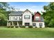 Charming two-story home featuring a brick facade and a spacious well-maintained front yard at 117 Constance Dr, Locust Grove, GA 30248