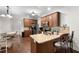 The kitchen features granite countertops, wooden cabinets, and stainless steel appliances at 117 Constance Dr, Locust Grove, GA 30248