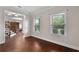 Living room featuring hardwood floors and ample natural light at 117 Constance Dr, Locust Grove, GA 30248