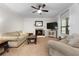 The living room has carpeted floors, neutral walls, a fireplace, and a ceiling fan at 117 Constance Dr, Locust Grove, GA 30248