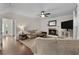 The living room has hardwood floors, neutral walls, a fireplace, and recessed lighting at 117 Constance Dr, Locust Grove, GA 30248