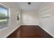 Home office featuring hardwood floors, ample natural light, and built-in shelving at 117 Constance Dr, Locust Grove, GA 30248