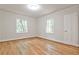 A well-lit bedroom features hardwood floors, neutral walls, and windows offering natural light and a cozy feel at 1986 N Decatur Ne Rd, Atlanta, GA 30307