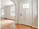 Bright entryway boasting hardwood floors, a white front door, and an arched doorway at 1986 N Decatur Ne Rd, Atlanta, GA 30307
