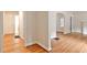 Hallway featuring hardwood floors, neutral walls, and doorways with arched openings at 1986 N Decatur Ne Rd, Atlanta, GA 30307
