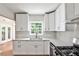 Modern kitchen with bright cabinets, and stainless steel appliances, with ample countertops for an enjoyable cooking experience at 1986 N Decatur Ne Rd, Atlanta, GA 30307