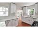 Recently remodeled kitchen with bright cabinets, modern appliances, and plenty of natural light shining through the windows at 1986 N Decatur Ne Rd, Atlanta, GA 30307