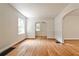 Bright living room with hardwood floors, arched doorways, and natural light from windows at 1986 N Decatur Ne Rd, Atlanta, GA 30307