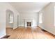 Living room showcasing hardwood floors, a fireplace, and arched doorways for an open feel at 1986 N Decatur Ne Rd, Atlanta, GA 30307
