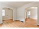 Spacious living area featuring gleaming hardwood floors, neutral walls, and arched openings at 1986 N Decatur Ne Rd, Atlanta, GA 30307