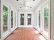 Charming sunroom with tile floors and multiple windows providing scenic views and ample natural light at 1986 N Decatur Ne Rd, Atlanta, GA 30307