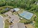 Aerial view of community amenities including a pool, playground, and tennis courts at 410 Gardens Of Harmony Dr, Canton, GA 30115