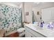 This bathroom features a single vanity, an artistic shower curtain and a framed mirror at 410 Gardens Of Harmony Dr, Canton, GA 30115