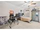 This bedroom has a comfortable bed, large armoire and desk with gaming equipment at 410 Gardens Of Harmony Dr, Canton, GA 30115