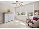 Bright bedroom featuring a large window, soft natural light, and cozy decor at 410 Gardens Of Harmony Dr, Canton, GA 30115