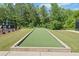 Image of a community bocce ball court with surrounding landscaping and outdoor seating at 410 Gardens Of Harmony Dr, Canton, GA 30115