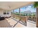 Spacious covered deck with ceiling fan, string lights, and outdoor seating overlooking the backyard at 410 Gardens Of Harmony Dr, Canton, GA 30115