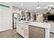 Bright kitchen featuring a large island with stainless steel appliances and quartz countertops at 410 Gardens Of Harmony Dr, Canton, GA 30115