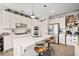 Modern kitchen features a large island and stainless steel appliances at 410 Gardens Of Harmony Dr, Canton, GA 30115