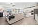Open-concept living area flows seamlessly to kitchen, perfect for modern living at 410 Gardens Of Harmony Dr, Canton, GA 30115