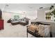 Spacious living room featuring an oversized sofa and a stairway at 410 Gardens Of Harmony Dr, Canton, GA 30115