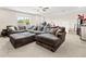 Spacious living room featuring an oversized sofa at 410 Gardens Of Harmony Dr, Canton, GA 30115